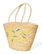 Bolso tote de rafia beige con bordado de limones y asas dobles anchas.