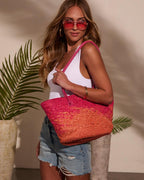 Bolso tote de rafia rosa y naranja, asas fucsia y tejido en espiga
