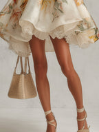 Minivestido organza beige con dobladillo de encaje y estampado floral, falda con vuelo