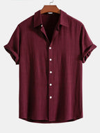Camisa abotonada de lino y rayón color granate con botones blancos y cuello