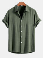 Camisa abotonada de lino y rayón color verde oscuro con botones blancos