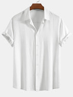 Camisa abotonada de lino y rayón blanca con cuello y botones discretos
