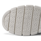 Suela de zapatilla blanca con dibujo antideslizante y relieve en patrón