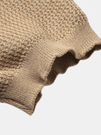 Polo Amalfi de punto beige con puño acanalado y borde de manga