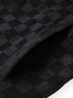 Superficie de ante negro con estampado cuadros y costuras laterales