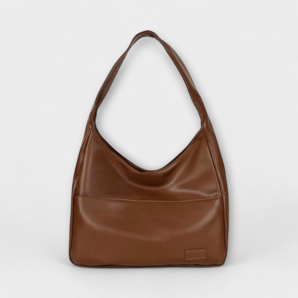 Bolso maxi de hombro marrón con asa superior y bolsillo frontal