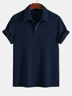 Polo de manga corta azul marino, cuello con tapeta y botones, tejido de rizo
