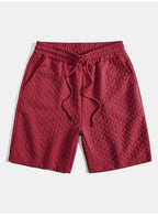 Pantalones cortos de jacquard geométrico burdeos con cintura elástica y cordón