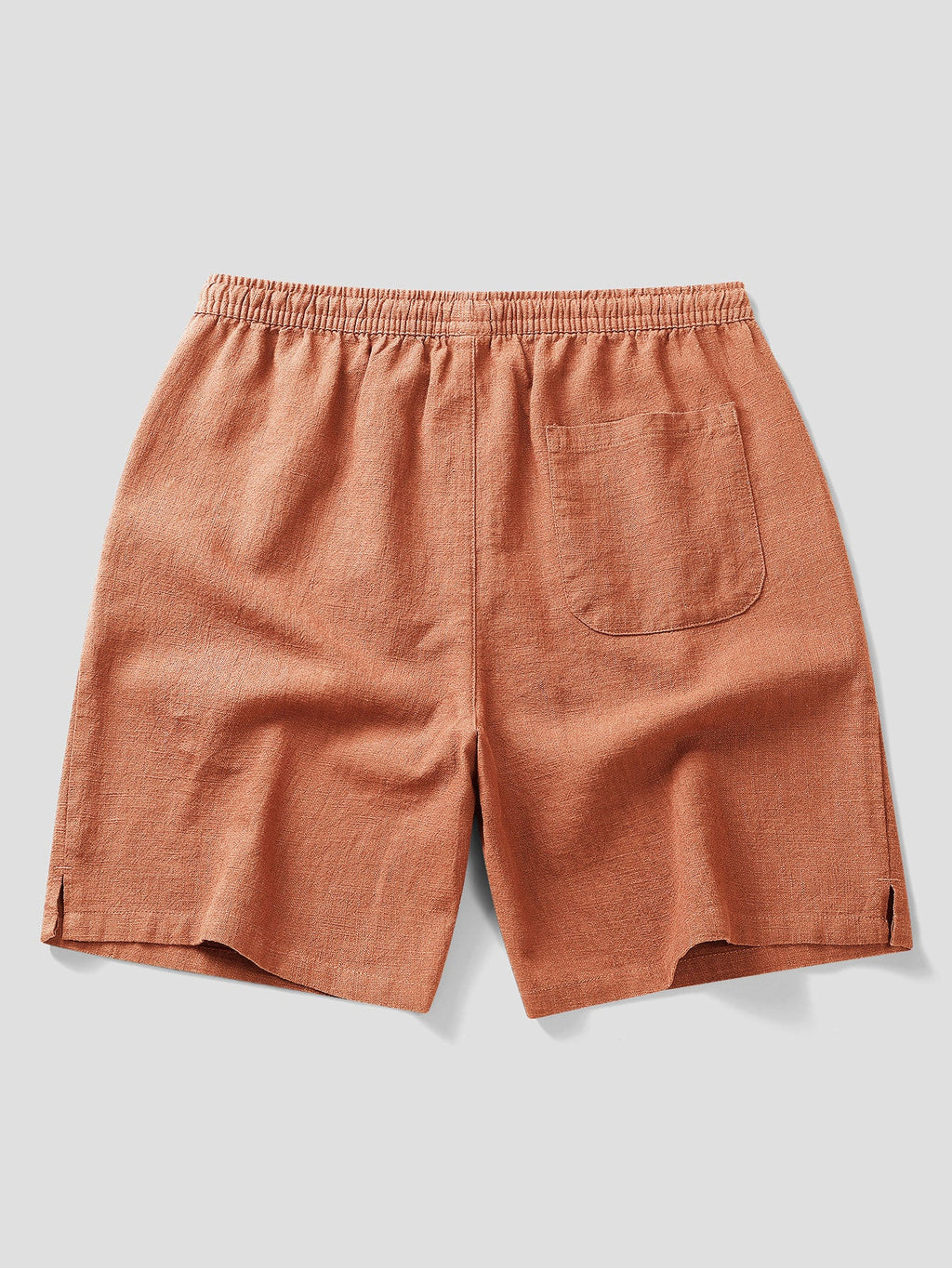 Pantalón corto de lino color teja, cintura elástica con bolsillo delantero y bolsillos.