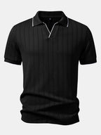 Polo de jacquard geométrico negro con cuello clásico y cierre tipo media cremallera