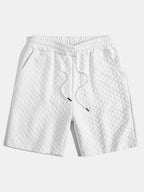 Pantalones cortos de jacquard geométrico blanco con cintura elástica y cordón