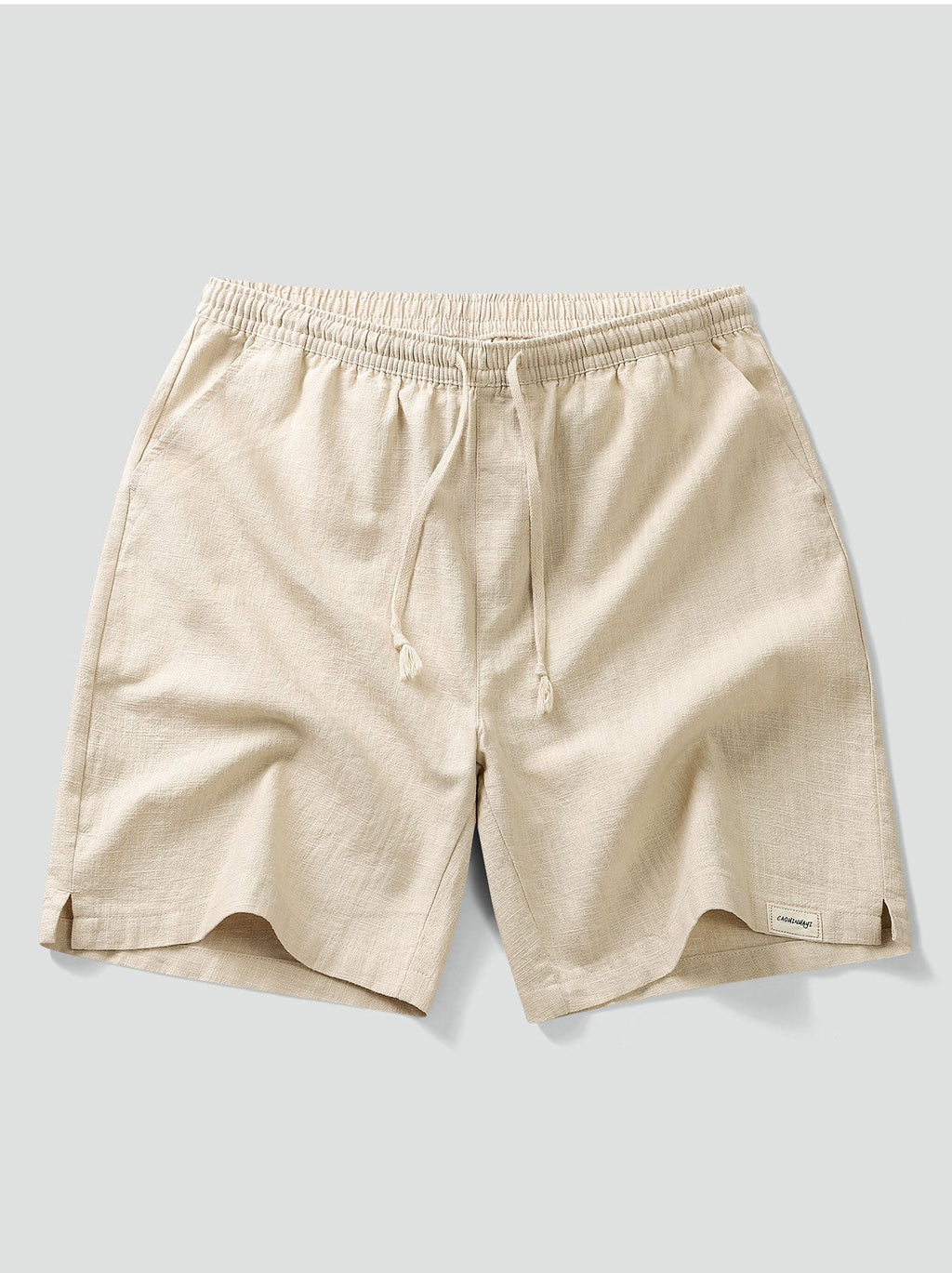 Pantalón corto beige de algodón con cintura elástica, cordón y bolsillos laterales