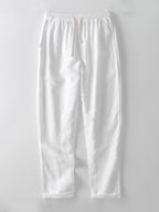 Pantalón recto de lino blanco con pretina elástica y costuras visibles