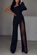 Mono palazzo negro con abertura lateral y panel de tul brillante en la pierna