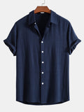 Camisa Riviera azul marino de manga corta, con botones y cuello clásico
