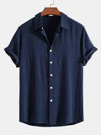 Camisa Riviera azul marino de manga corta, con botones y cuello clásico