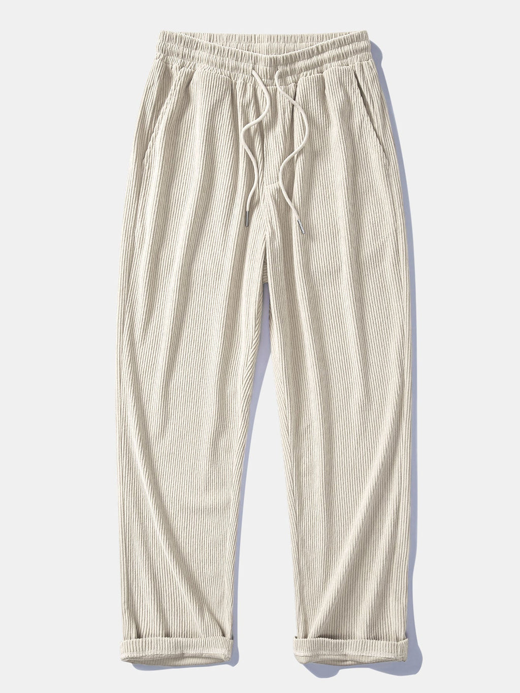 Pantalón recto de pana beige claro, cintura elástica con cordón y bolsillos.