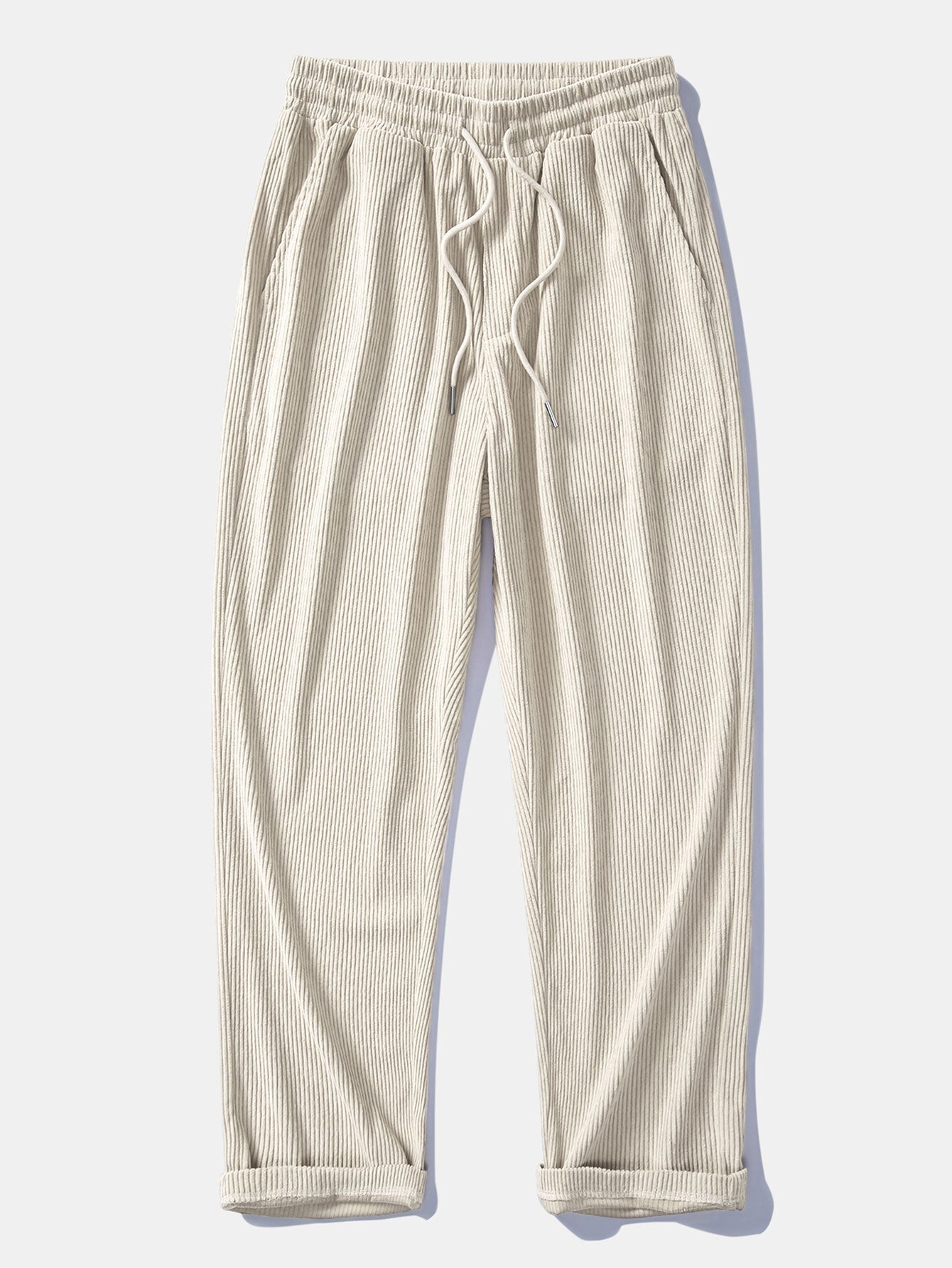 Pantalón recto de pana beige claro, cintura elástica con cordón y bolsillos.