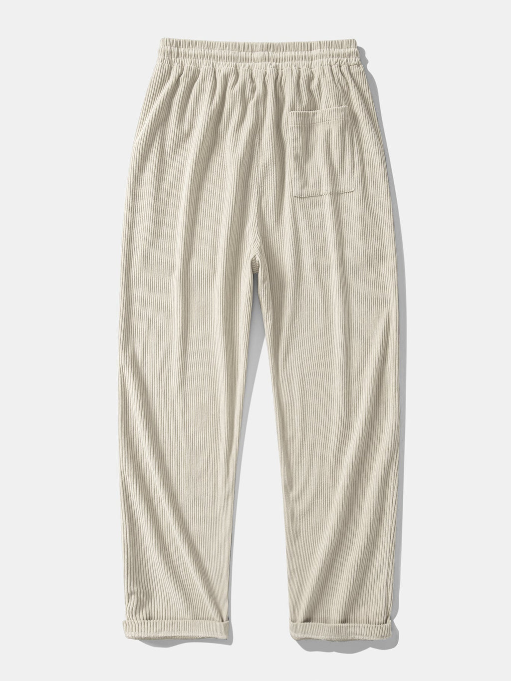 Pantalón recto de pana beige, cintura elástica con cordón y bolsillos laterales.