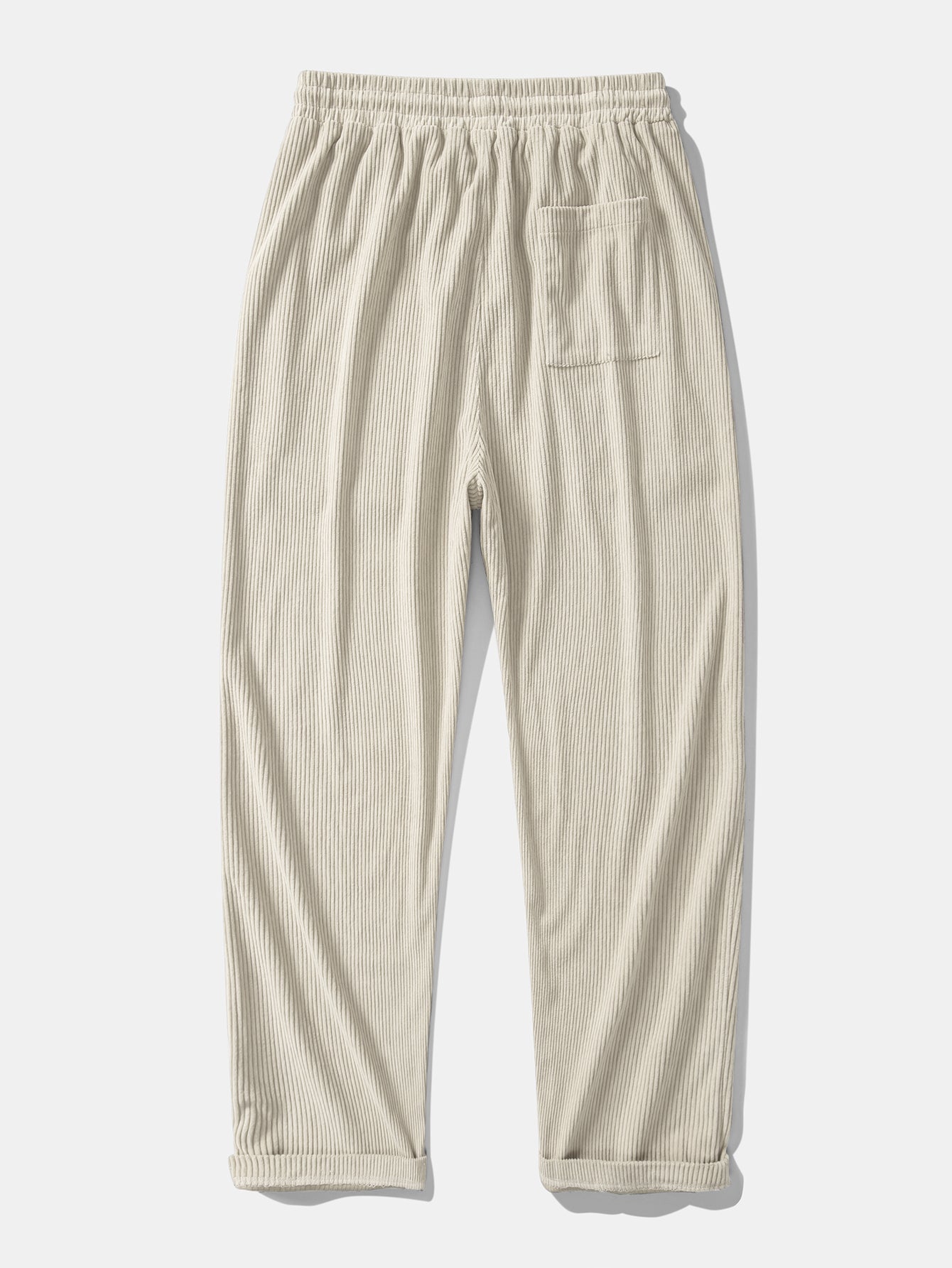 Pantalón recto de pana beige, cintura elástica con cordón y bolsillos laterales.