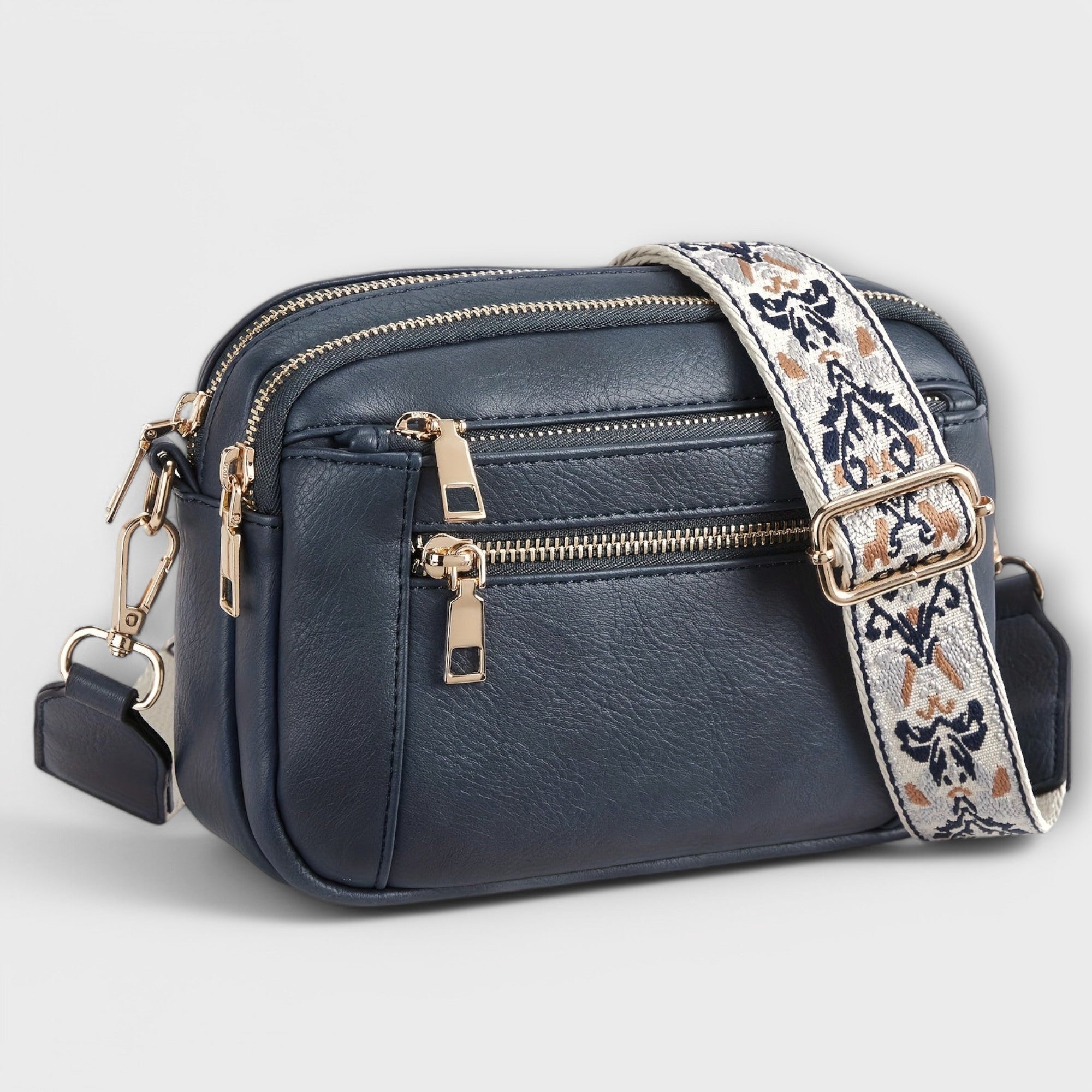 Bolso bandolera retro azul marino con correa estampada floral y bolsillos con cremalleras