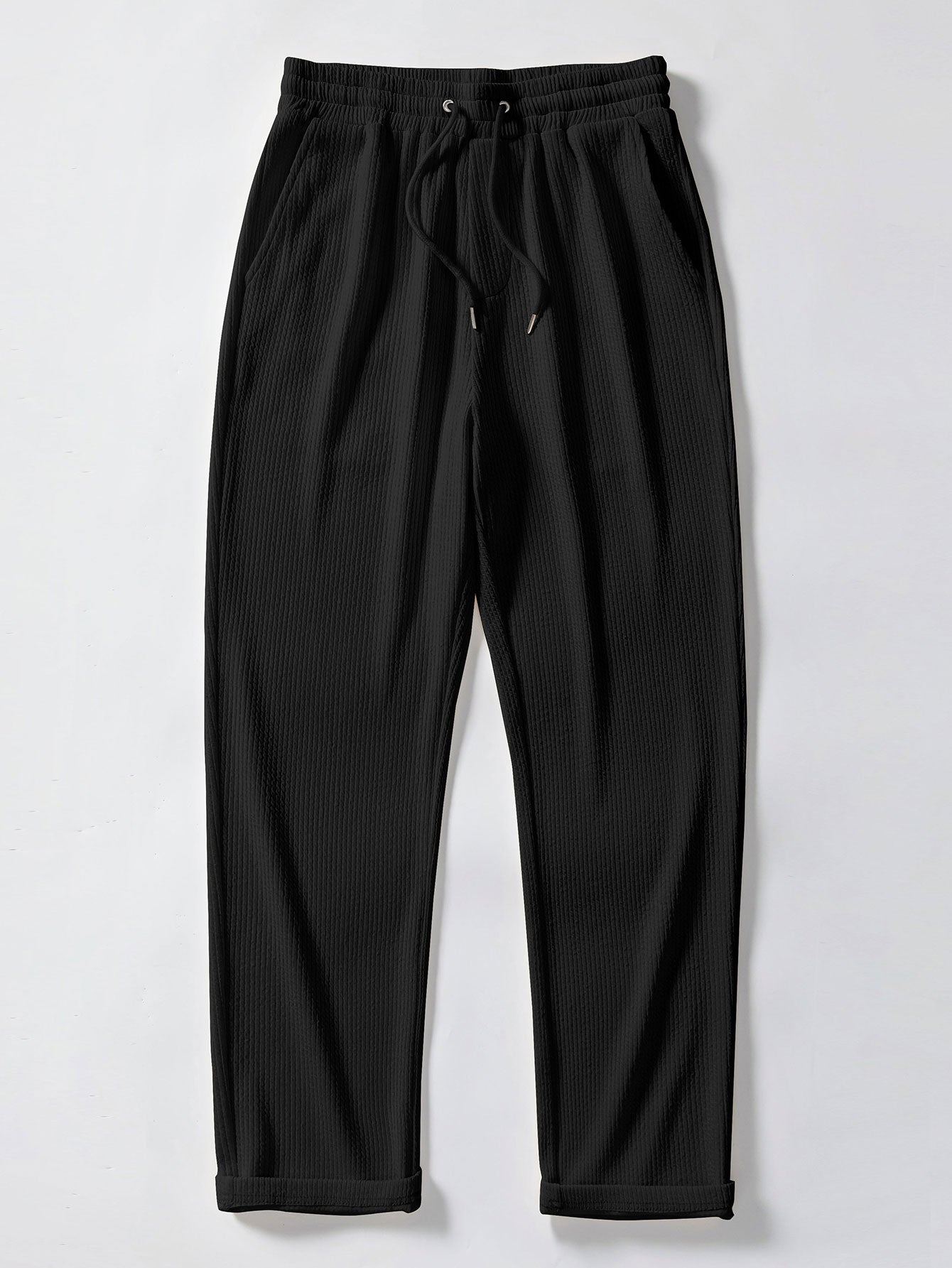 Pantalones rectos negros de tejido acanalado con cordón en la cintura