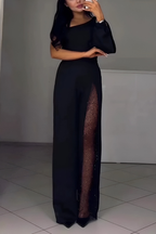 Mono palazzo negro de manga drapeada con abertura lateral y panel de tul