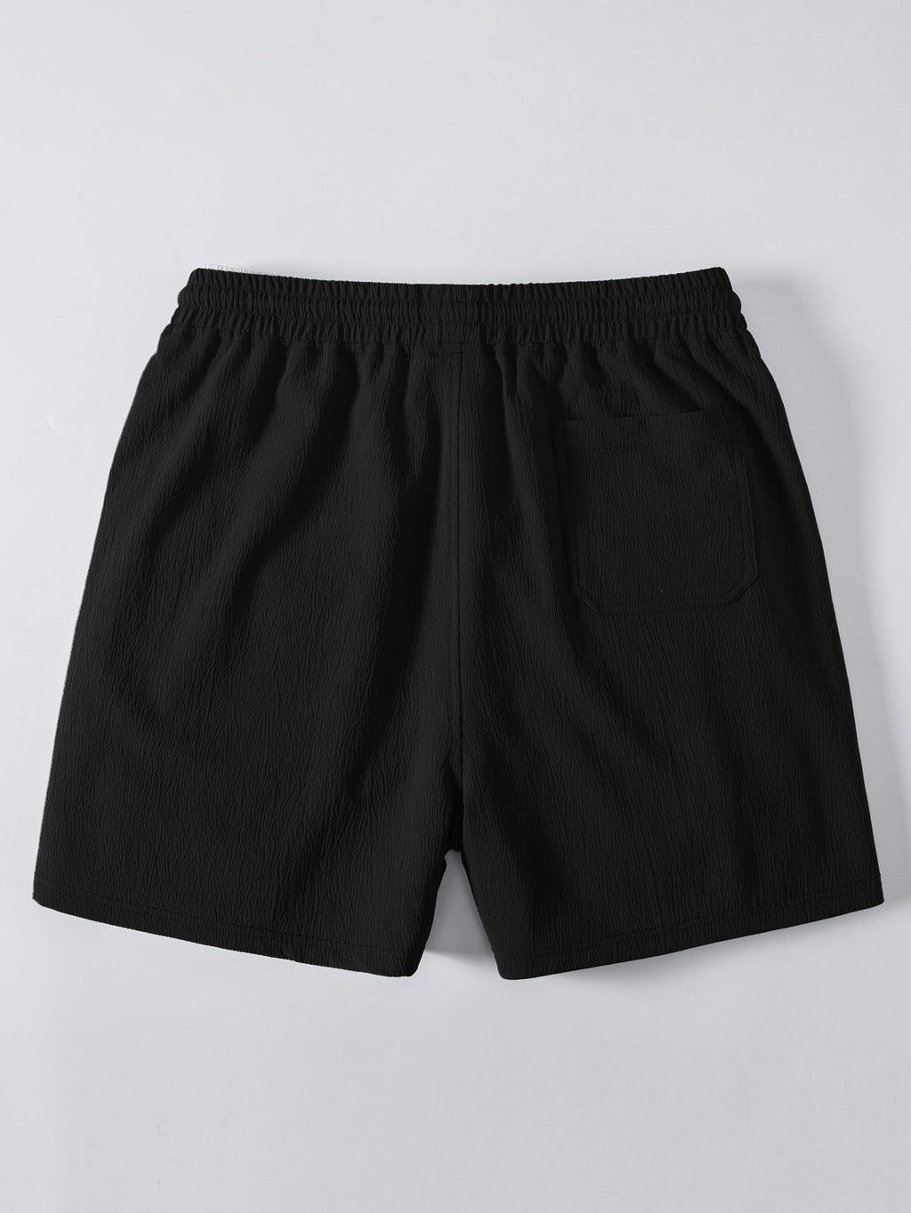 Pantalón corto negro con cintura elástica y caída recta, vista trasera