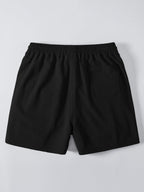 Pantalón corto negro con cintura elástica y caída recta, vista trasera