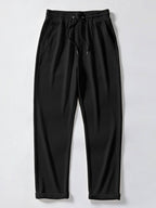 Pantalón recto negro con cintura elástica y cordón, dobladillo acanalado