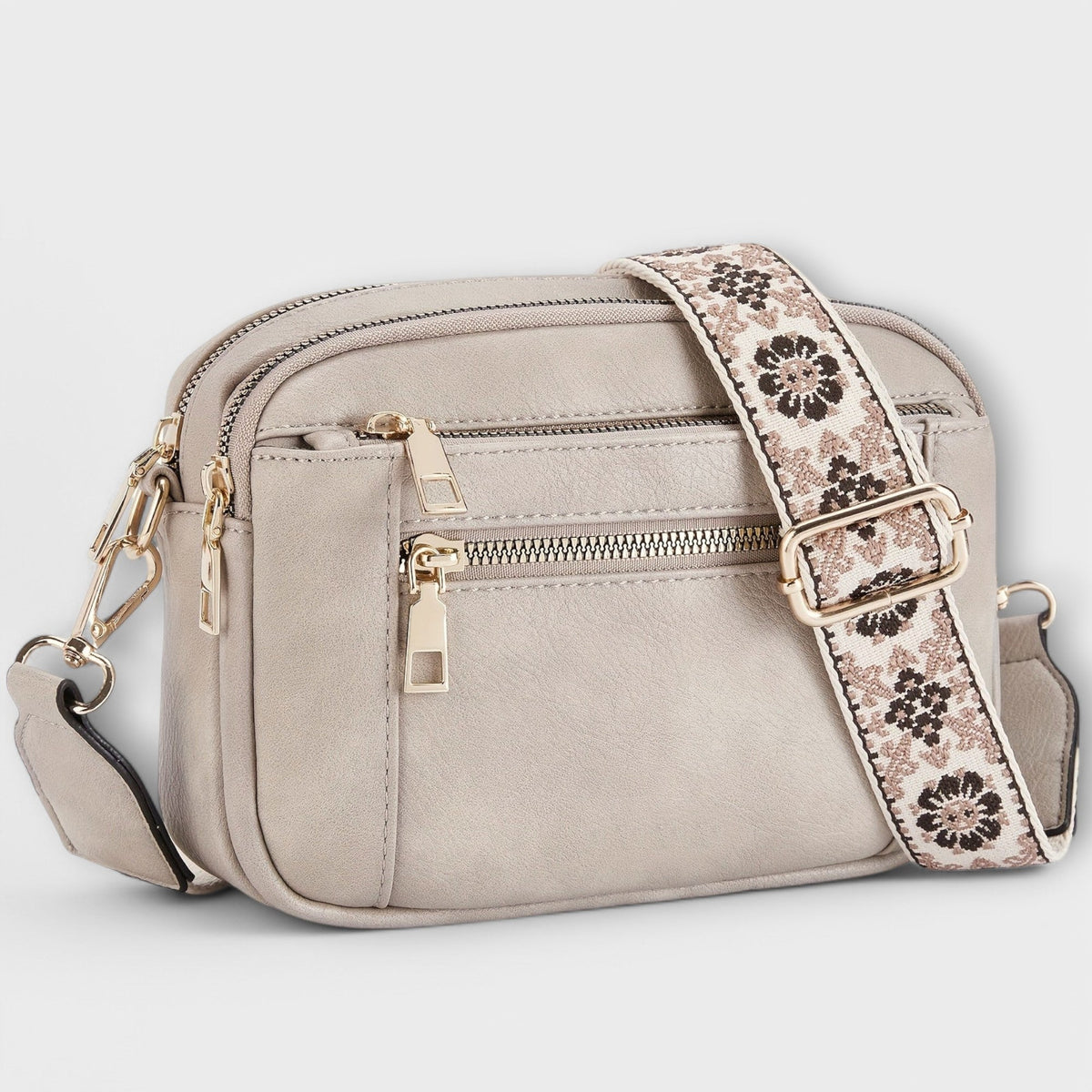 Bolso bandolera retro beige con correa estampada floral y bolsillos con cremalleras