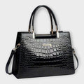 Bolso de piel efecto cocodrilo negro con asas superiores y bandolera