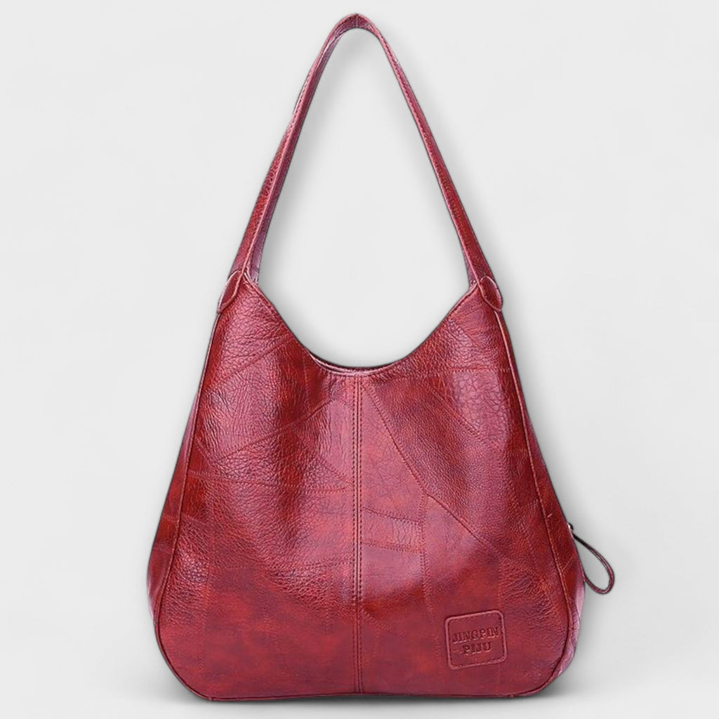 Bolso hobo de piel rojo con asas largas y pequeño bolsillo frontal con cierre