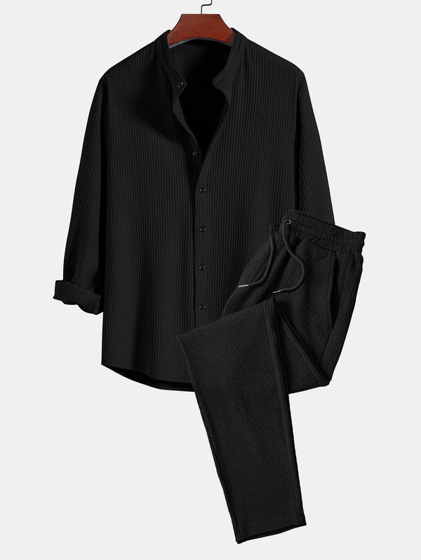 Conjunto de camisa abotonada de manga larga y pantalón recto acanalado negro, cuello de pie