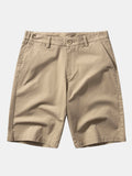 Pantalón corto de algodón color camel, cintura con botón y bolsillos frontales