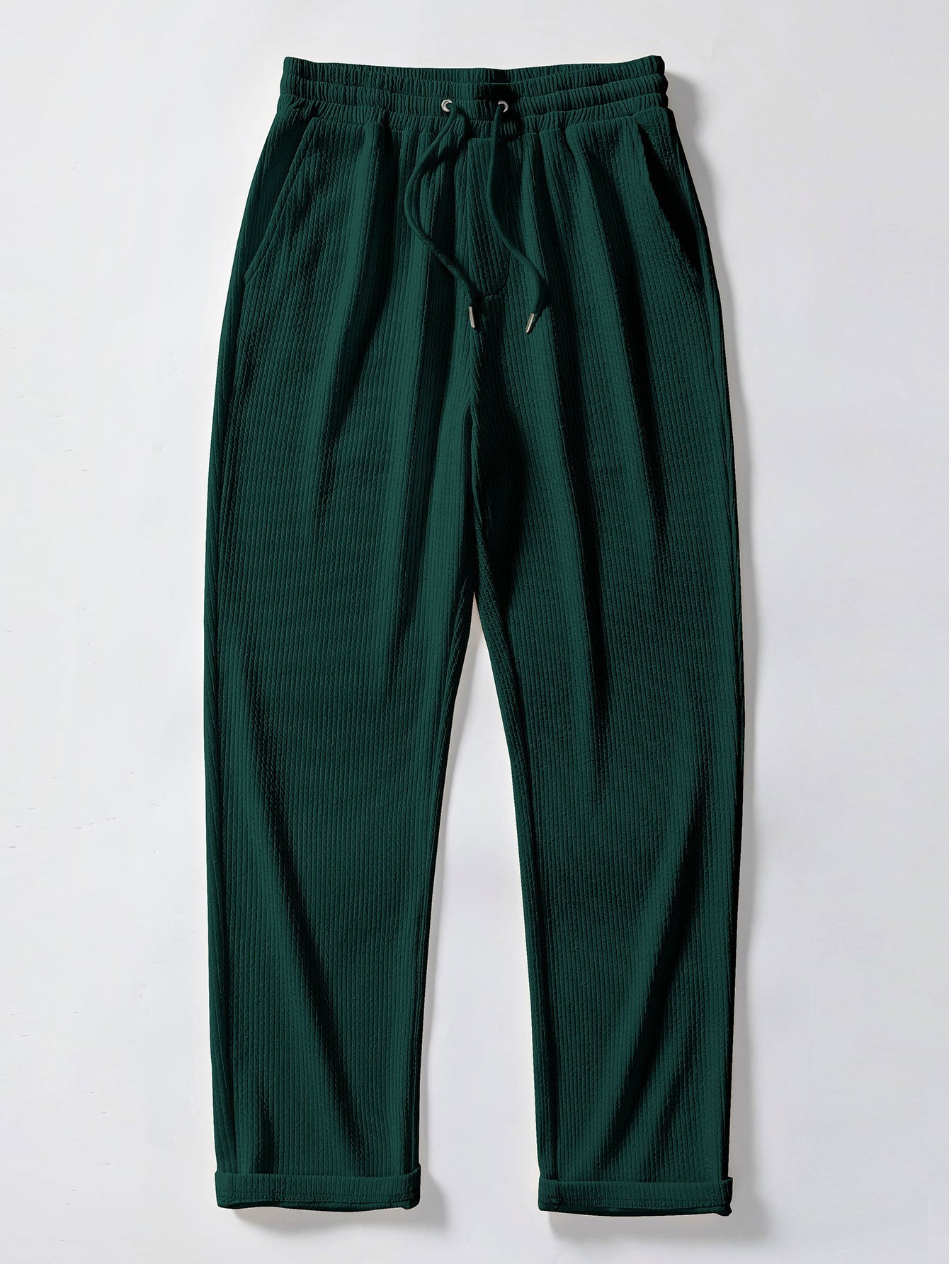 Pantalón recto acanalado verde oscuro, cintura elástica con cordón y dobladillo