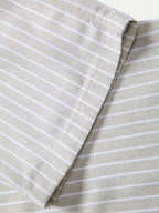 Tela de pantalón de lino a rayas beige, vista de la costura lateral