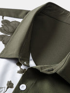 Detalle de botones blancos en camisa verde oscuro con panel blanco y estampado floral