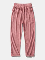 Pantalón recto de pana rosa, cintura elástica con cordón y bolsillo en la pierna.