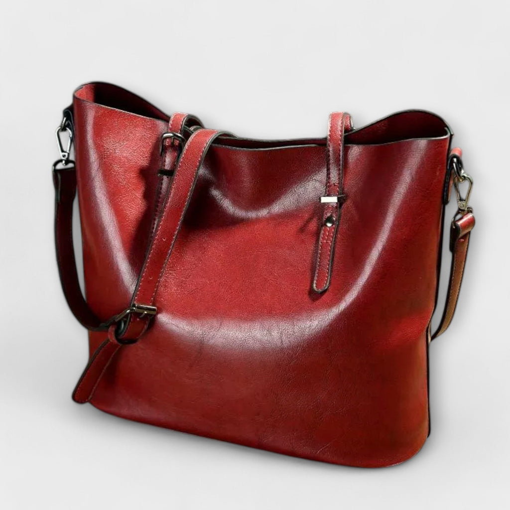 Bolso Tavrèa rojo con doble asa, bandolera y herrajes metálicos