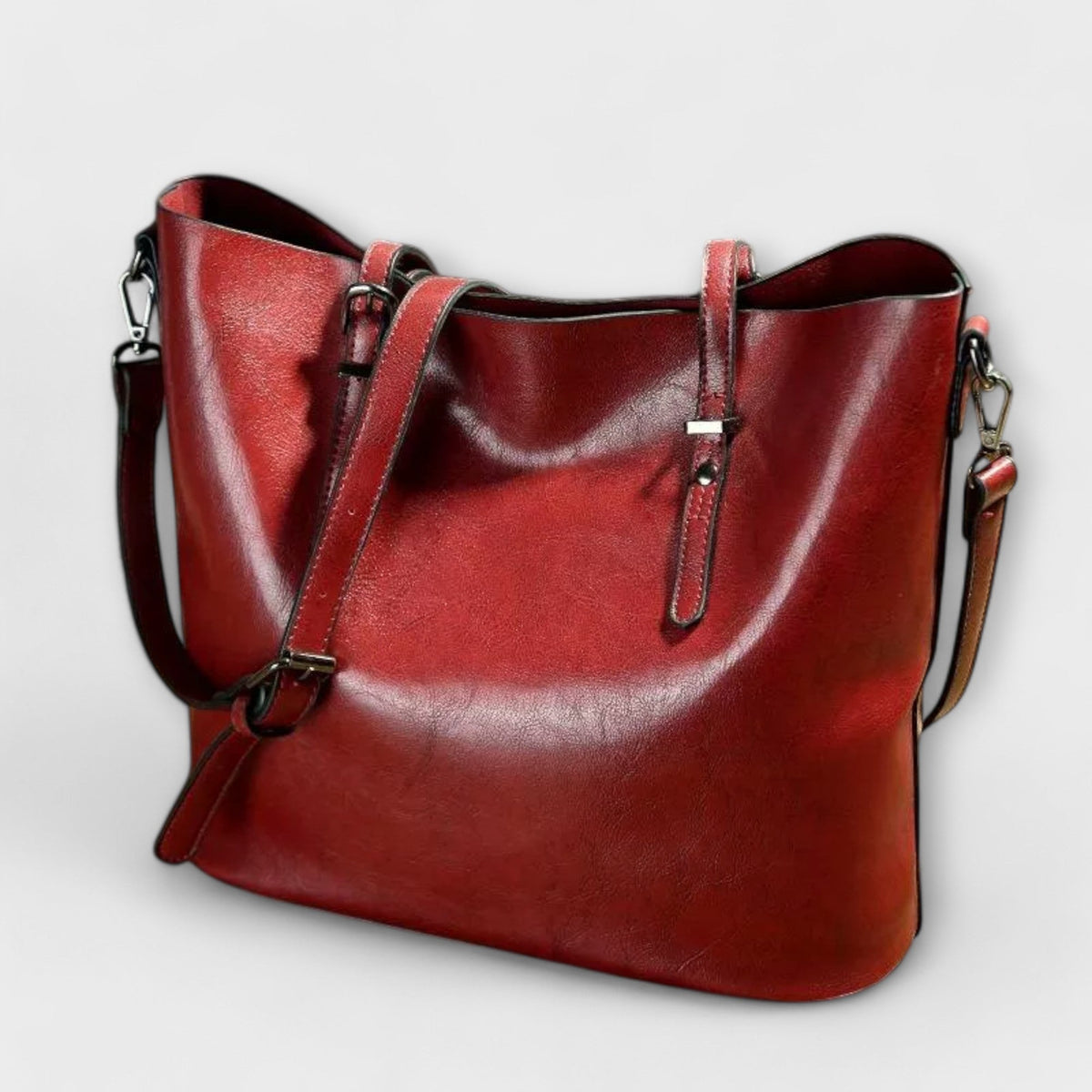 Bolso Tavrèa rojo con doble asa, bandolera y herrajes metálicos