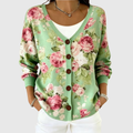 Chaqueta de punto verde con flores rosas, botones delanteros y cuello en V