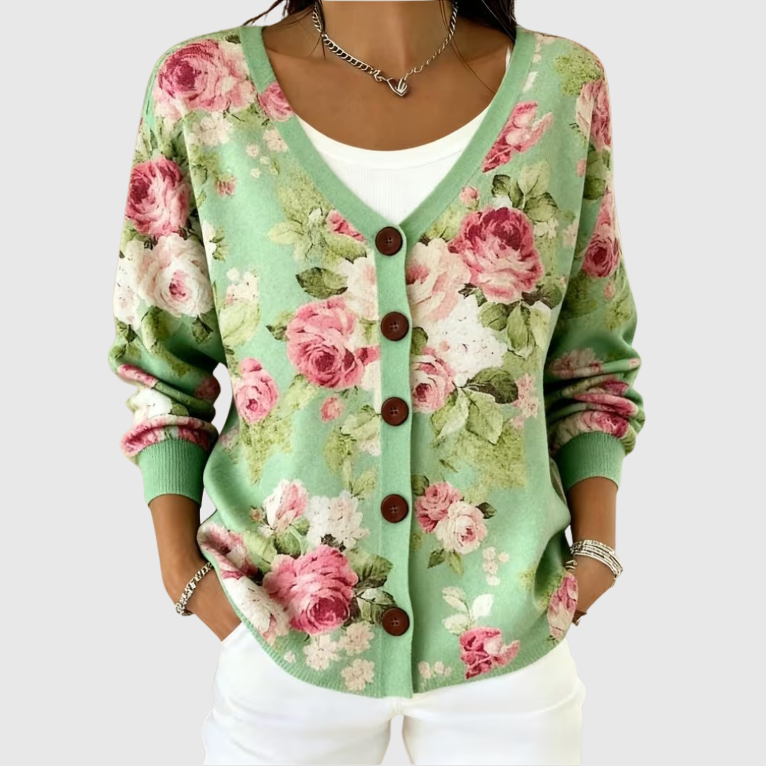 Chaqueta de punto verde con flores rosas, botones delanteros y cuello en V