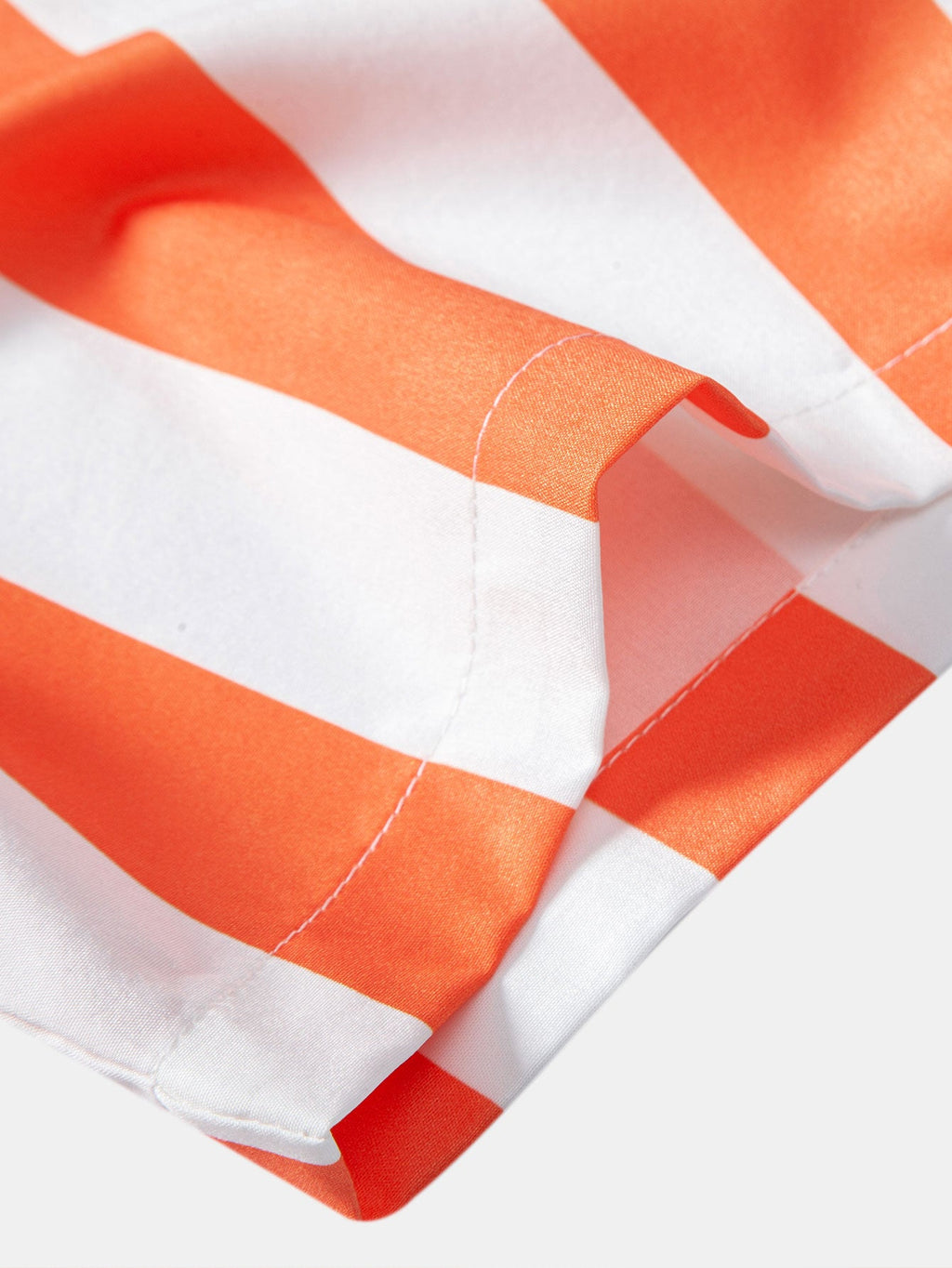 Camisa de rayas naranjas y blancas: puño con costuras y dobladillo