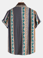 Camisa estampada con rayas verticales, cuello y manga corta; base oscura y acentos en verde.