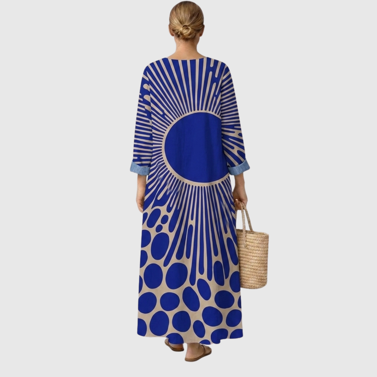 Vestido midi azul con estampado geométrico y panel circular central, espalda descubierta