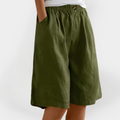 Pantalones efecto lino Valentina verde oliva, cintura elástica con botón y pernera ancha a la rodilla.
