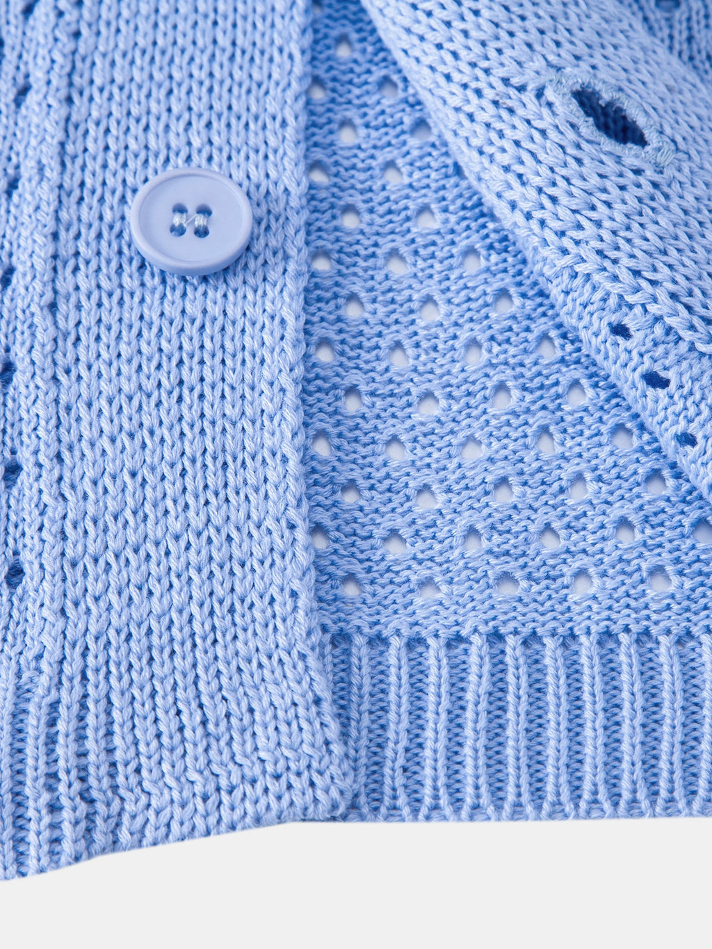 Camisa Marbella azul de punto calado con botón y bajo acanalado