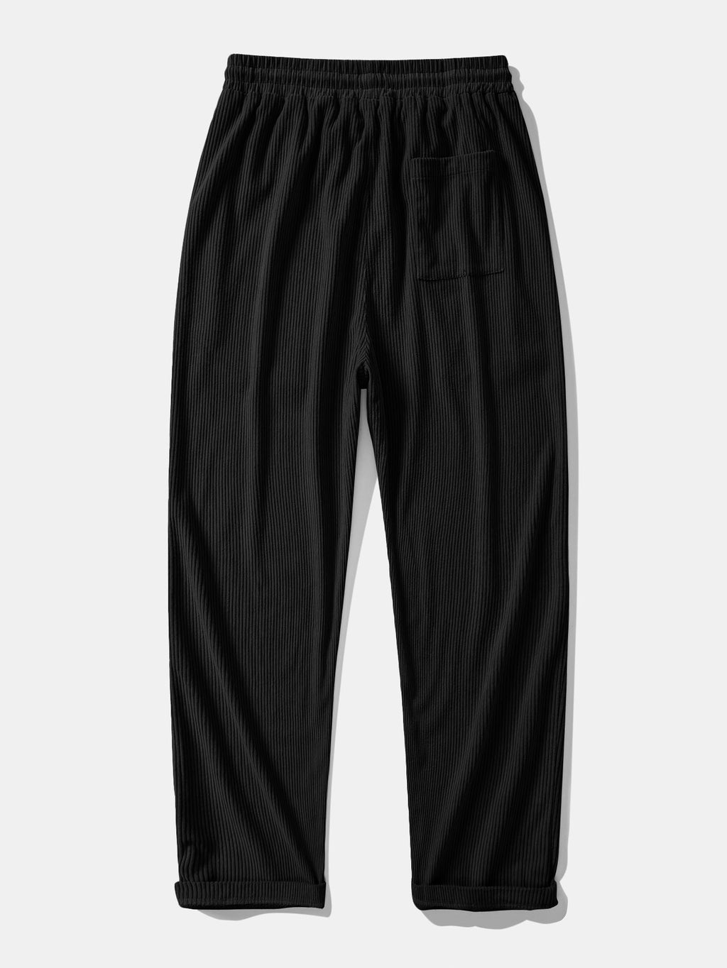 Pantalón recto de pana negro, cintura elástica con cordón y bolsillos laterales.