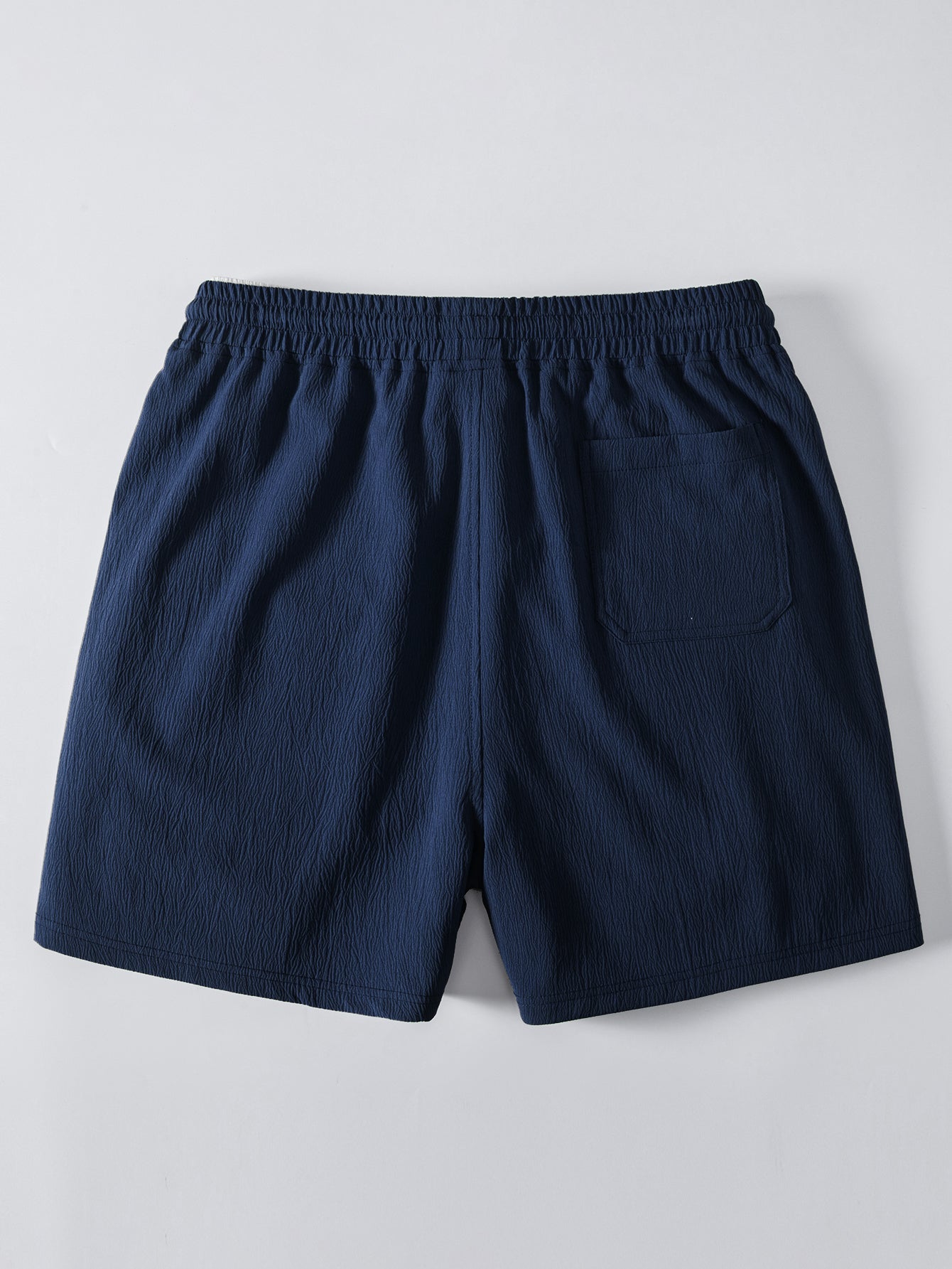 Pantalón corto azul marino con bolsillo lateral y cintura elástica